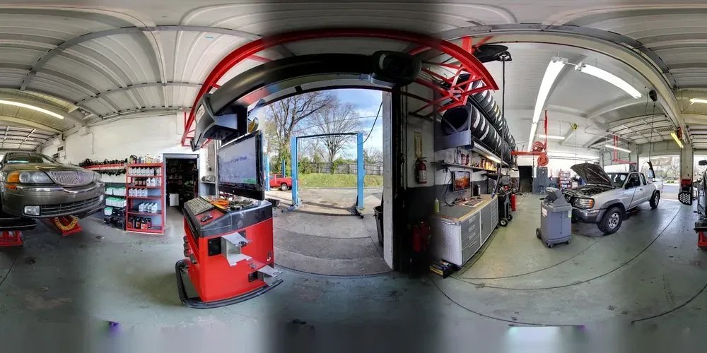 Repair bays and equipment inside Thompson Lane Auto
