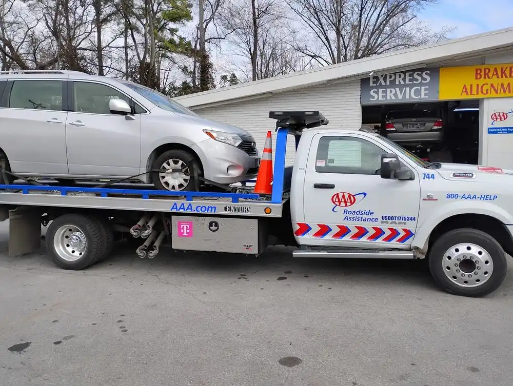 Tow truck delivering a vehicle to Thompson Lane Auto, Nashville, TN